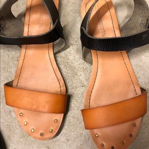 Tan and black sandals